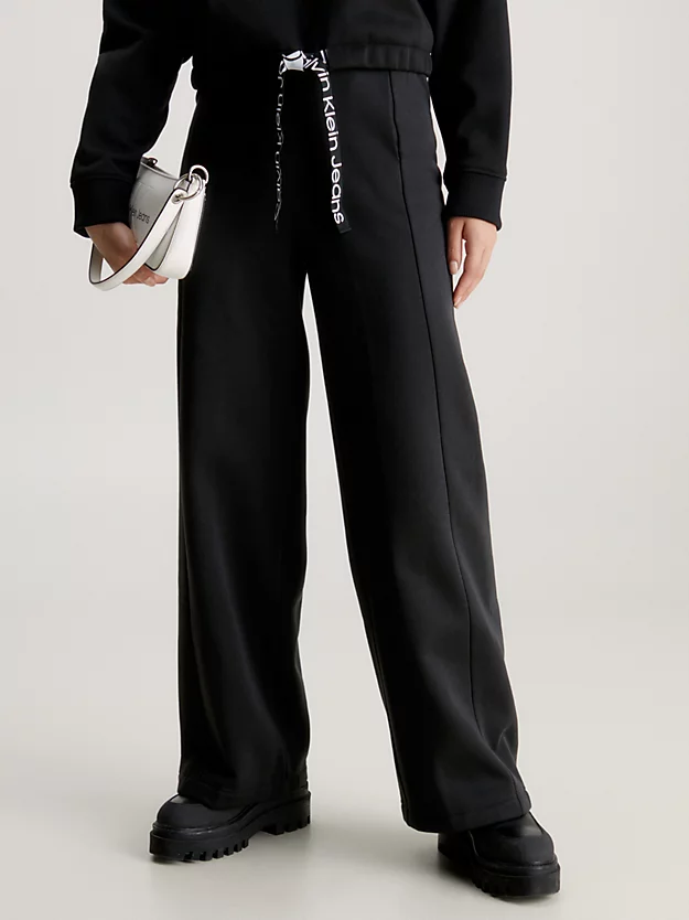 Calvin Klein Logo Tape Wide Leg Joggers 3 Calvin Klein Logo Tape Wide Leg Joggers